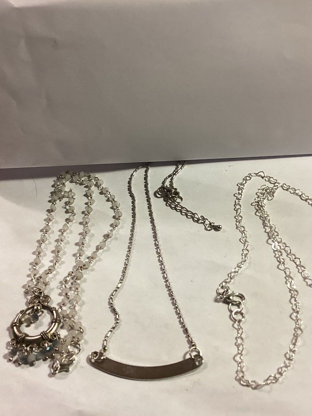 3 silver toned necklaces